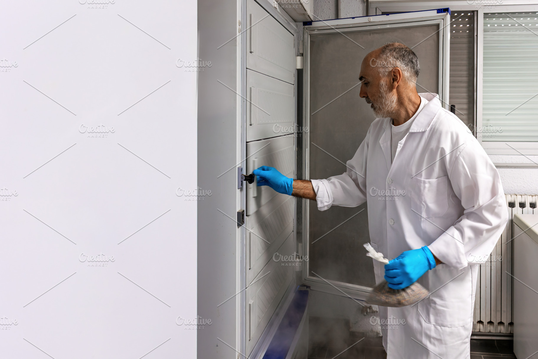 Scientist storing biological sample, a Health & Medical Photo by Perpis