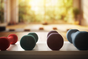 Neoprene dumbbells of different weights and colors on white tabl, a Sports & Recreation Photo by Davizro's Market