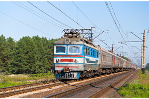 Passenger train hauled by electric locomotive stock photo containing train, a Transportation Photo by Leonid Andronov
