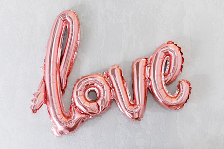 Love word from pink foil balloon