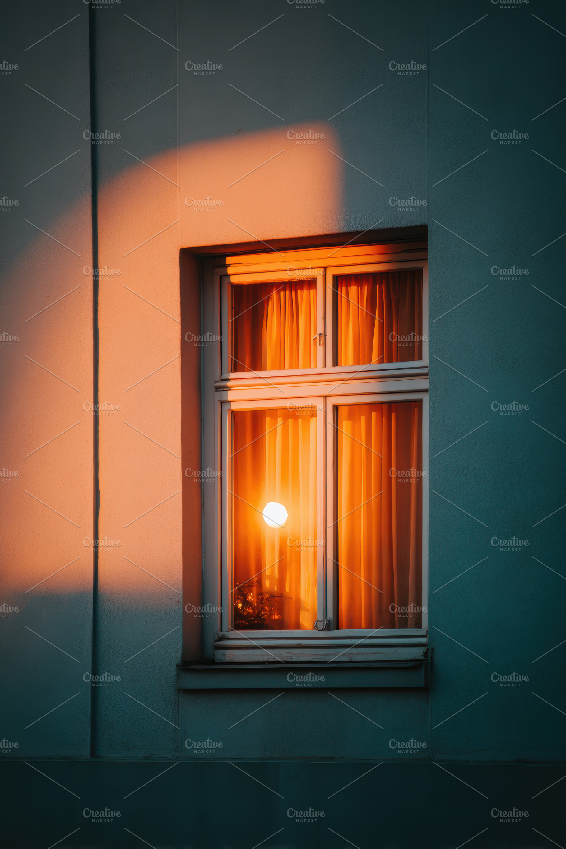 Glowing window at dusk with starry sky, an Architecture Photo by AlyaAnd