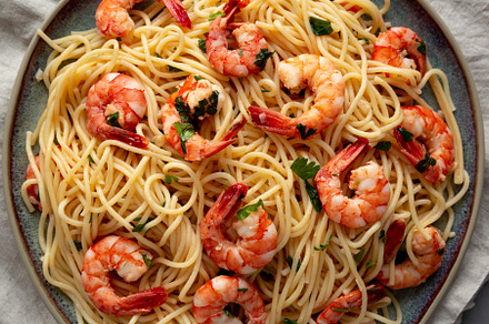 Homemade Cooked Garlic Shrimp Scampi on a Plate, top view. Flat, a Food & Drink Photo by LiudmylaChuhunova