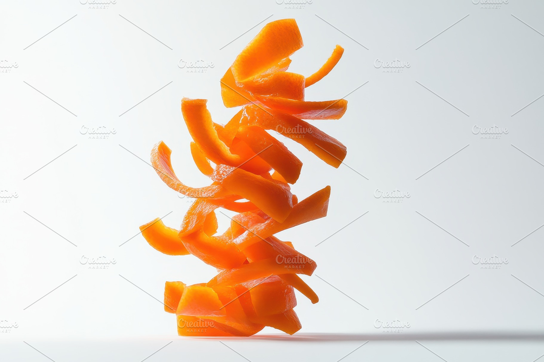 Freshly sliced carrots cascading, a Photo by Pavel_design
