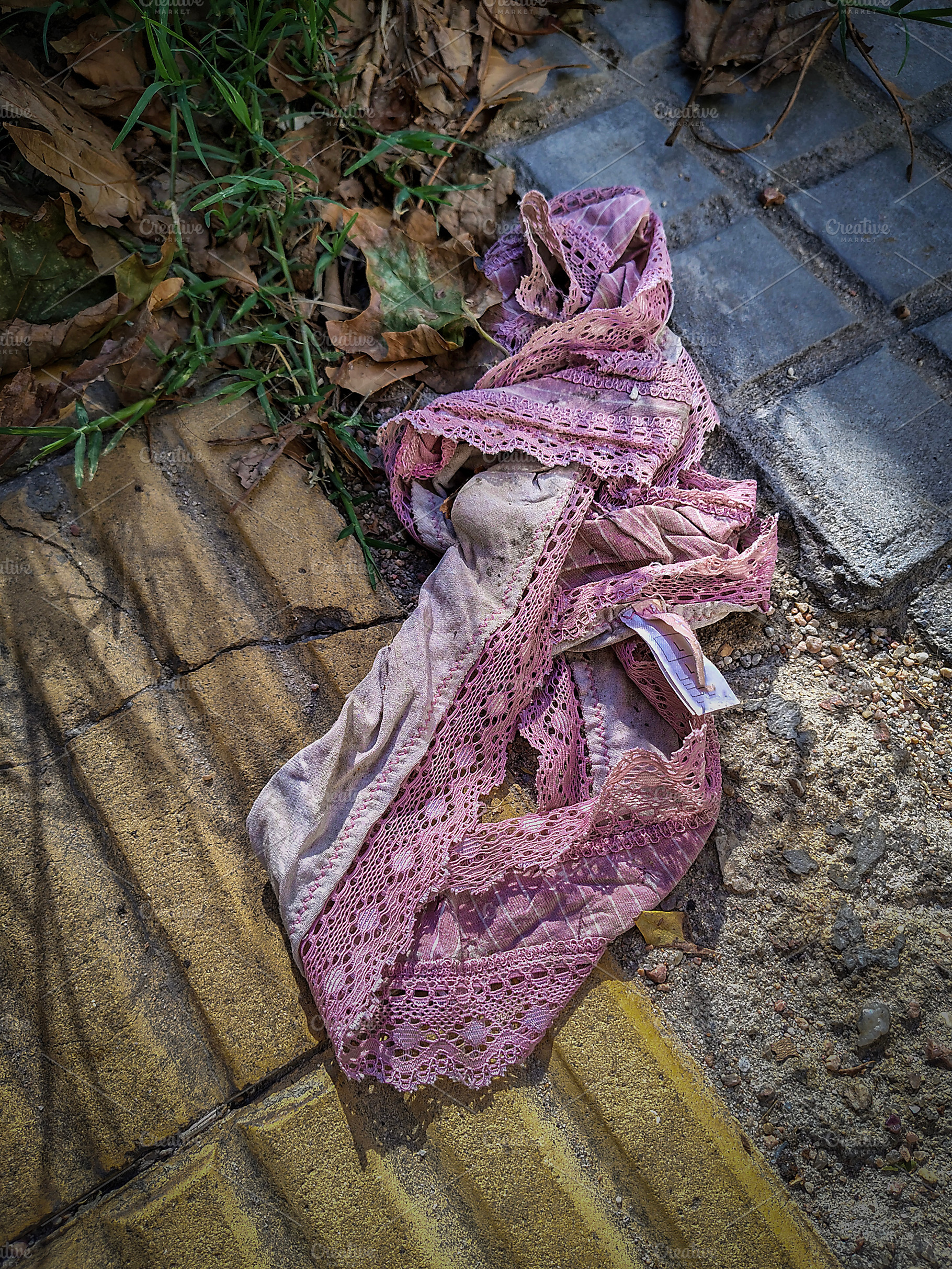 Women panties dropped on the sidewalk, an Industrial Photo by DanFLCreativo