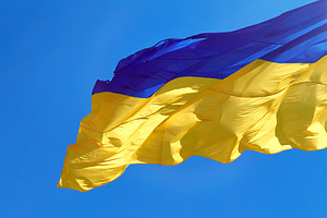 The national flag of Ukraine against a clear blue sky, an Abstract Photo by ndanko