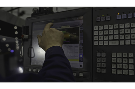 Worker with touch control panel for, an Industrial Photo by Media Whale Stock