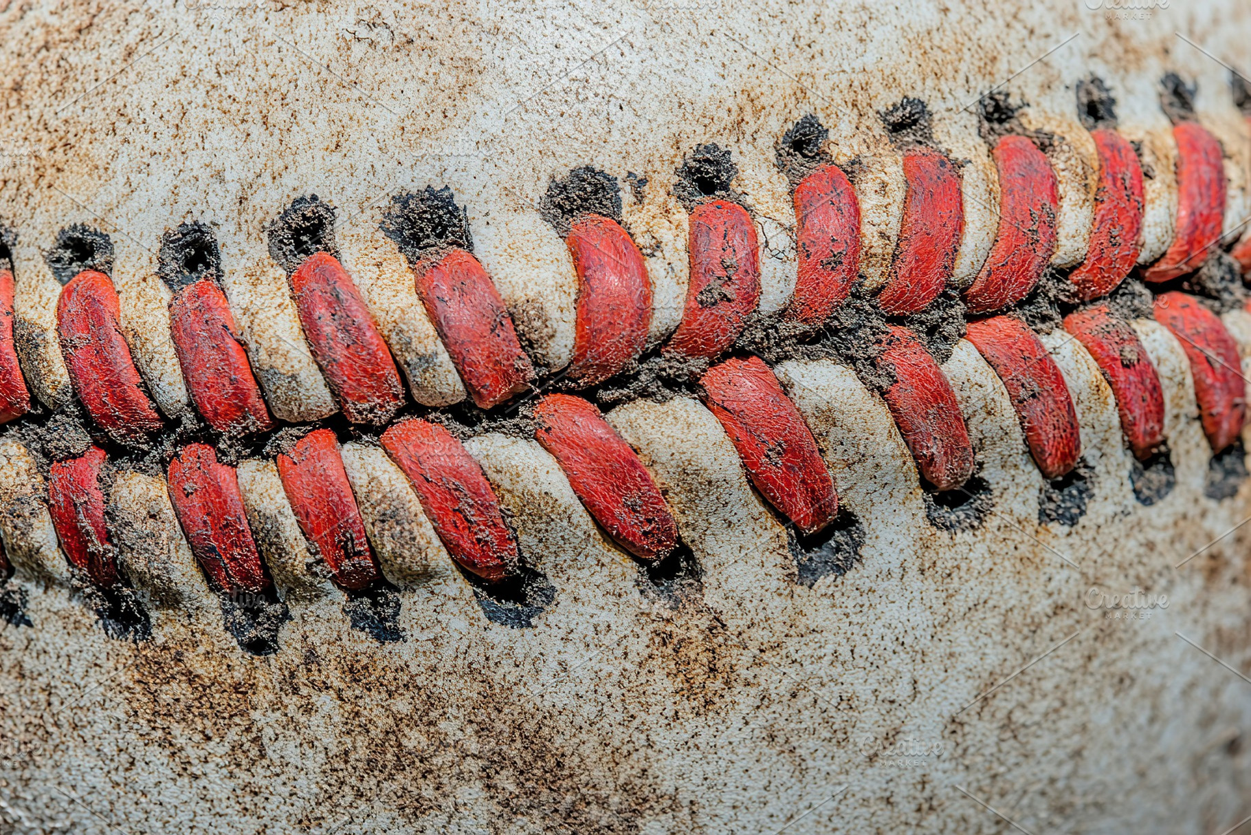 Closeup of red seam leather baseball, a Sports & Recreation Photo by AlyaAnd