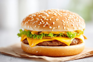 Double cheeseburger with sesame bun, a Food & Drink Photo by AlyaAnd