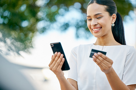 Woman, phone and credit card for ecommerce, online shopping or transaction in the outdoors. Happy female with smile for internet banking, 5G or app purchase on mobile smartphone technology outside, a Photo by Peopleimages.com