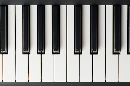 Black and white piano keys close up view, an Industrial Photo by PixieMe