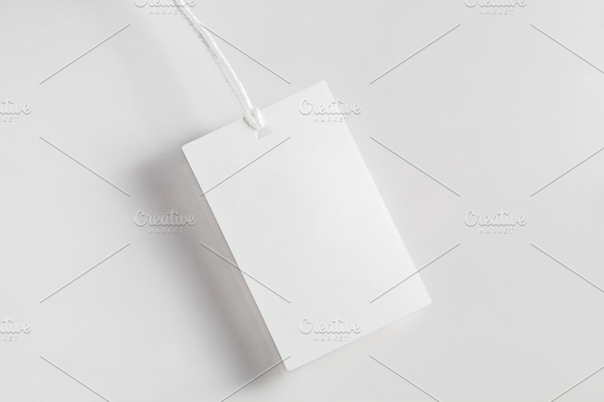 Clothes label tag blank white mockup, an Advertising Mockup by Olha Klein (Photo 2 of 3)