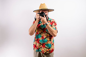 Smiling man ready for tropical vacation adventure, a Person Photo by karrastock