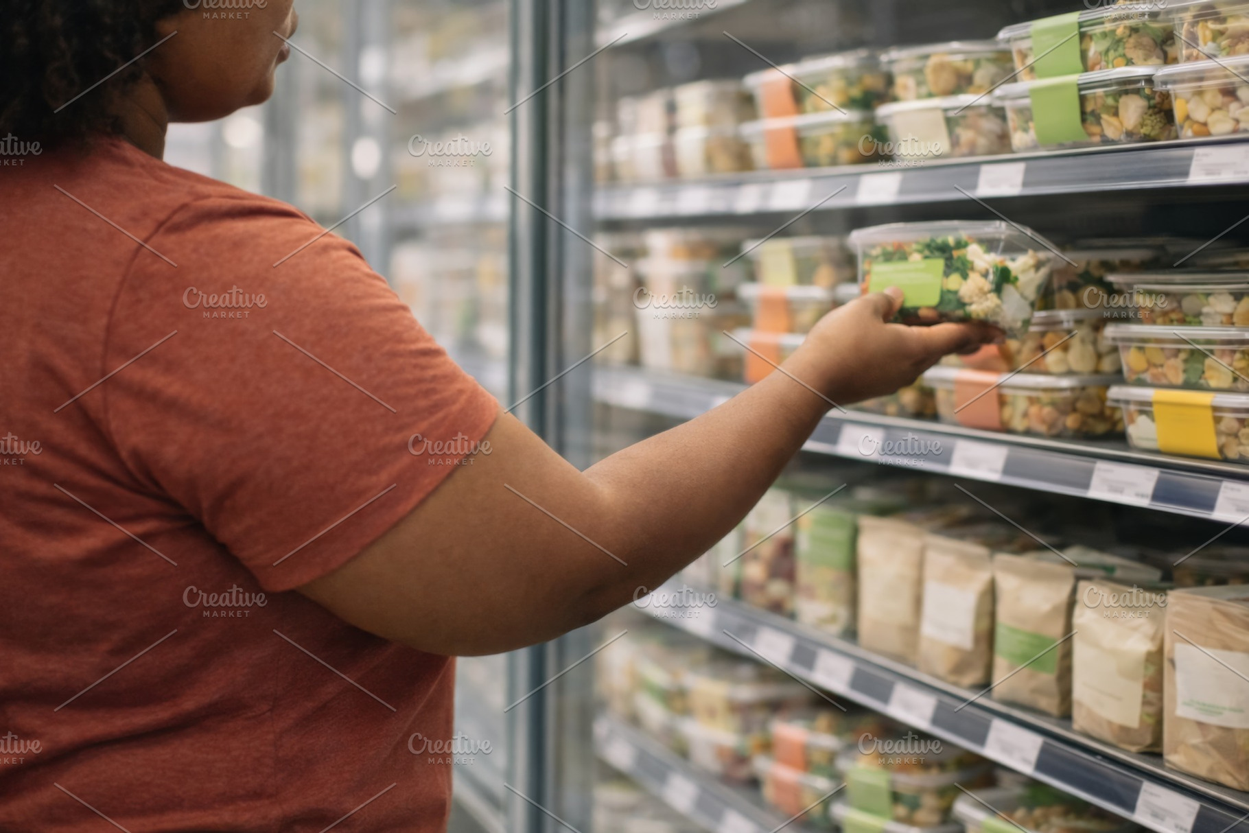 Person shopping for healthy food in grocery store aisle, a Photo by Dvoevnore photos