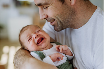 Close-up of father holding his, a Person Photo by HalfPoint