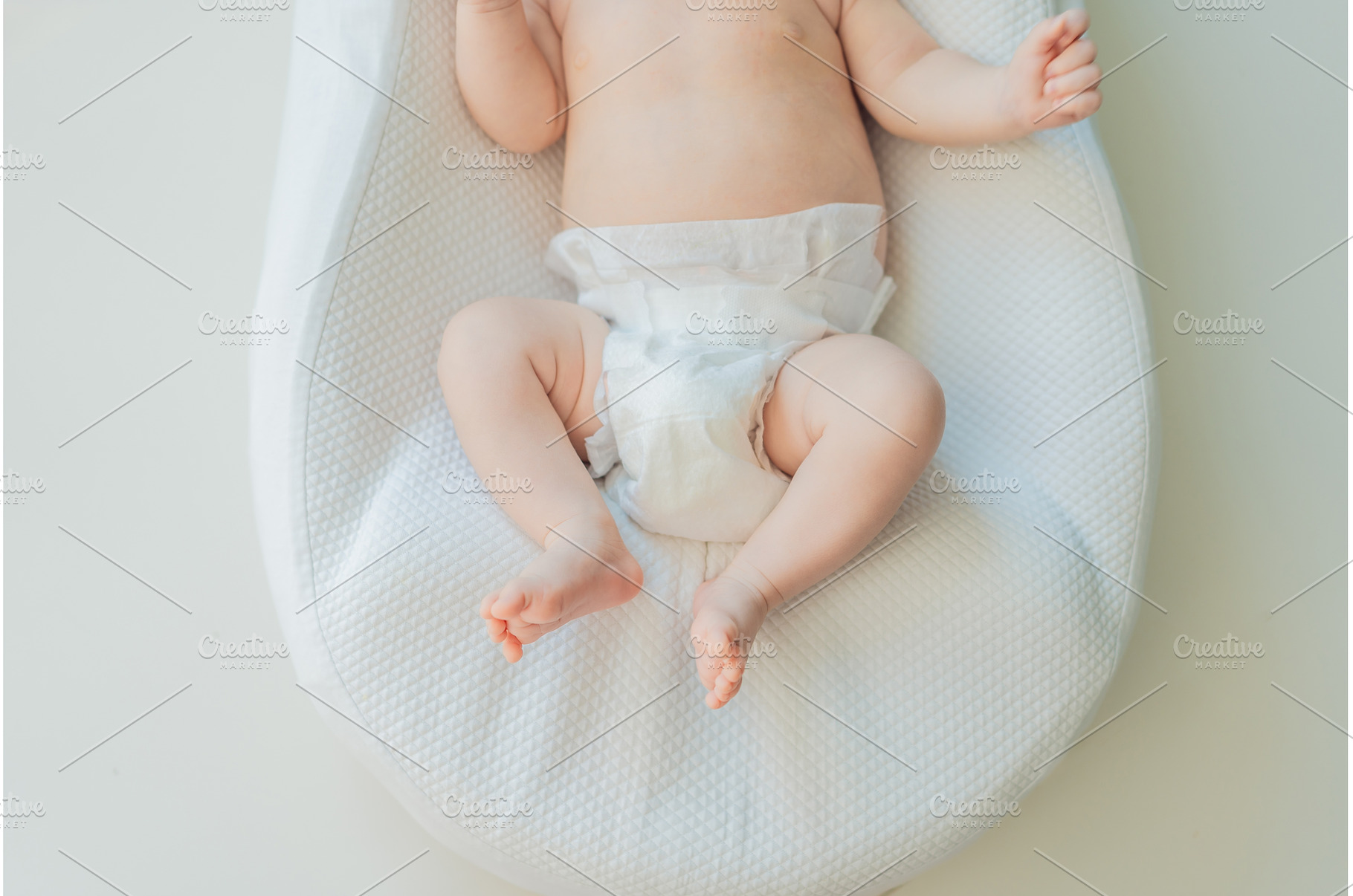 Newborn baby comfortably resting in, an Architecture Photo by Elizaveta Galitskaya