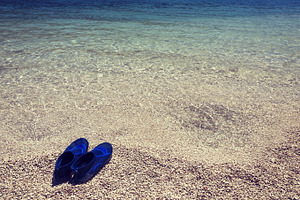 Swimming shoes on the beach, a Holiday Photo by BOOCYS
