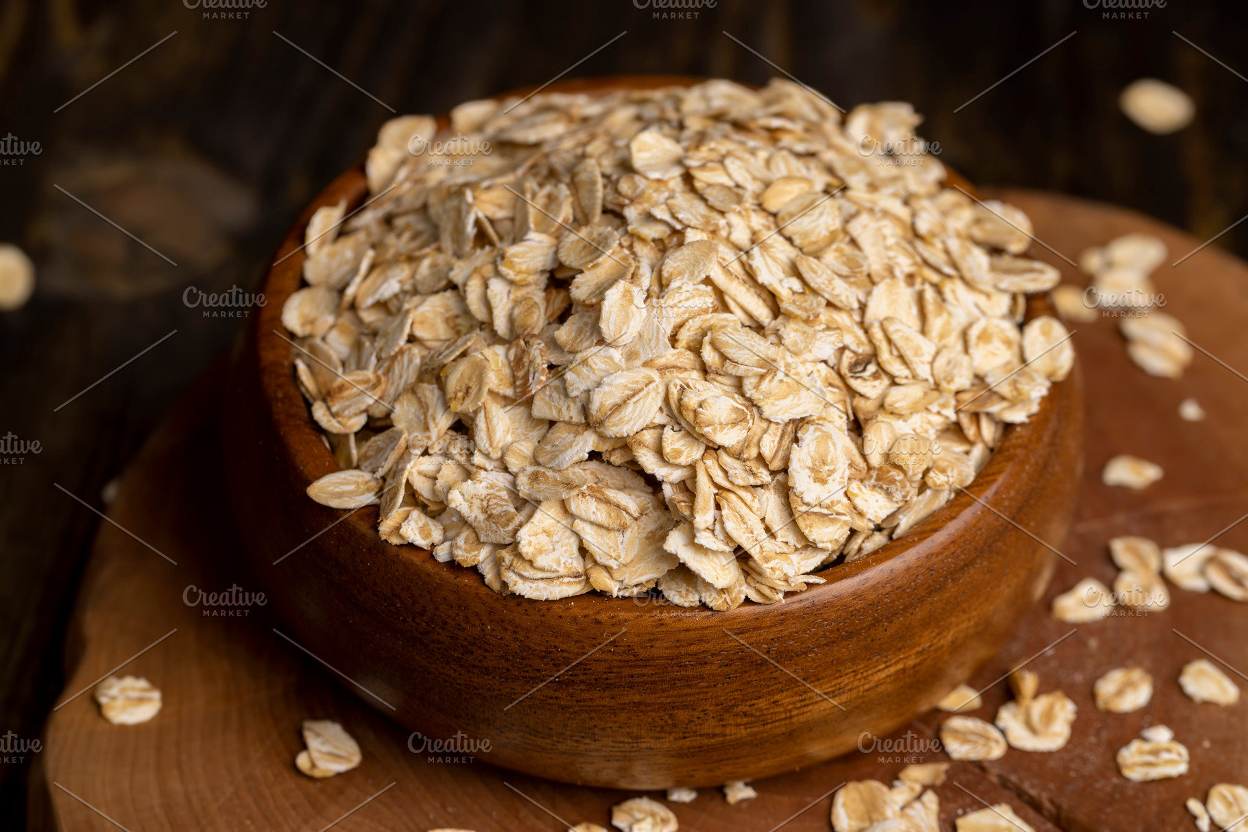 Oat flakes poured into a wooden bowl, a Food & Drink Photo by MyPhotos