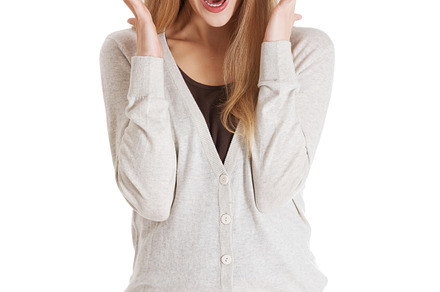 Beautiful positive and casual woman expressing surprise containing happy