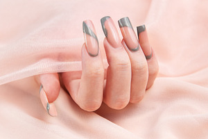 Female hand showing long square marble design nails, a Beauty & Fashion Photo by Olena Rudo