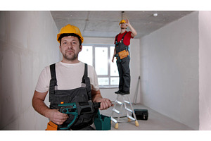 A man worker standing in front of, a Person Photo by Barcelona_dreams