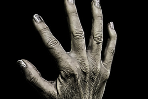 Mature woman hands with fingers open over black background, a Person Photo by DanFLCreativo