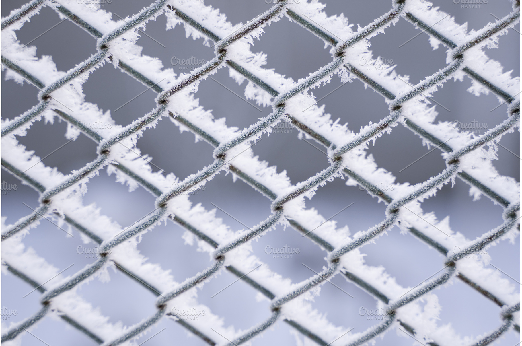 Detailed shot of frosty wire fence, a Background Photo by volodymyrshtun13795