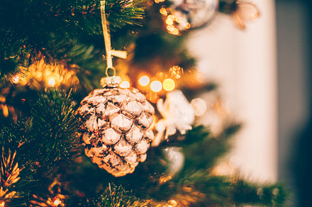 Christmas vintage toy pine cone on Christmas tree. Holiday background with boke, a Holiday Photo by Anikona