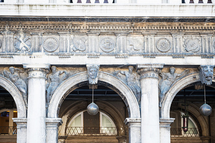 Details and arches at of facade at San Marco square in Venice, an Architecture Photo by Vapi