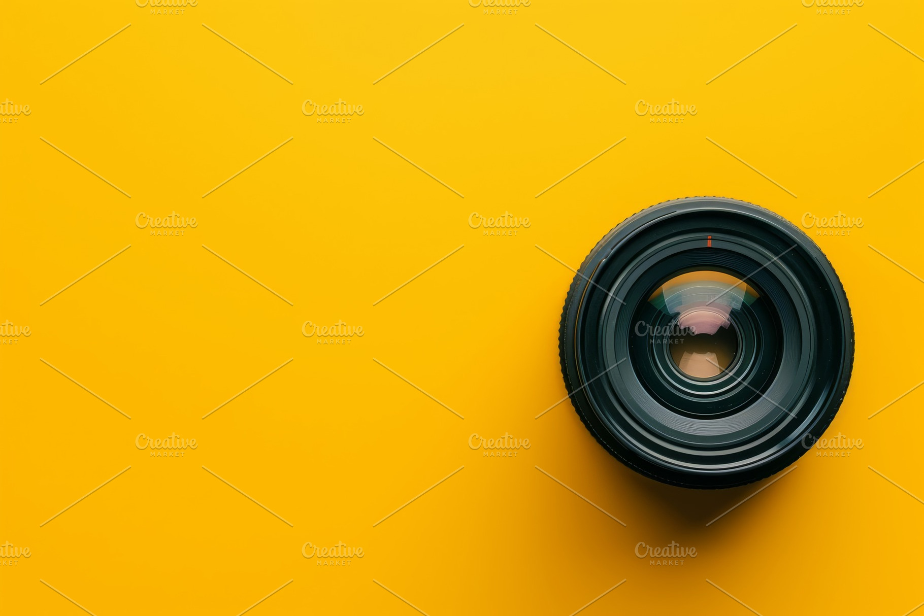 A close-up view of a camera lens res, a Photo by Tanuart