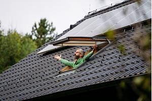 Man looking from skylight, roof, a Technology Photo by HalfPoint