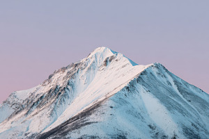 Snow-covered mountain at sunrise, a Photo by Beautiful things