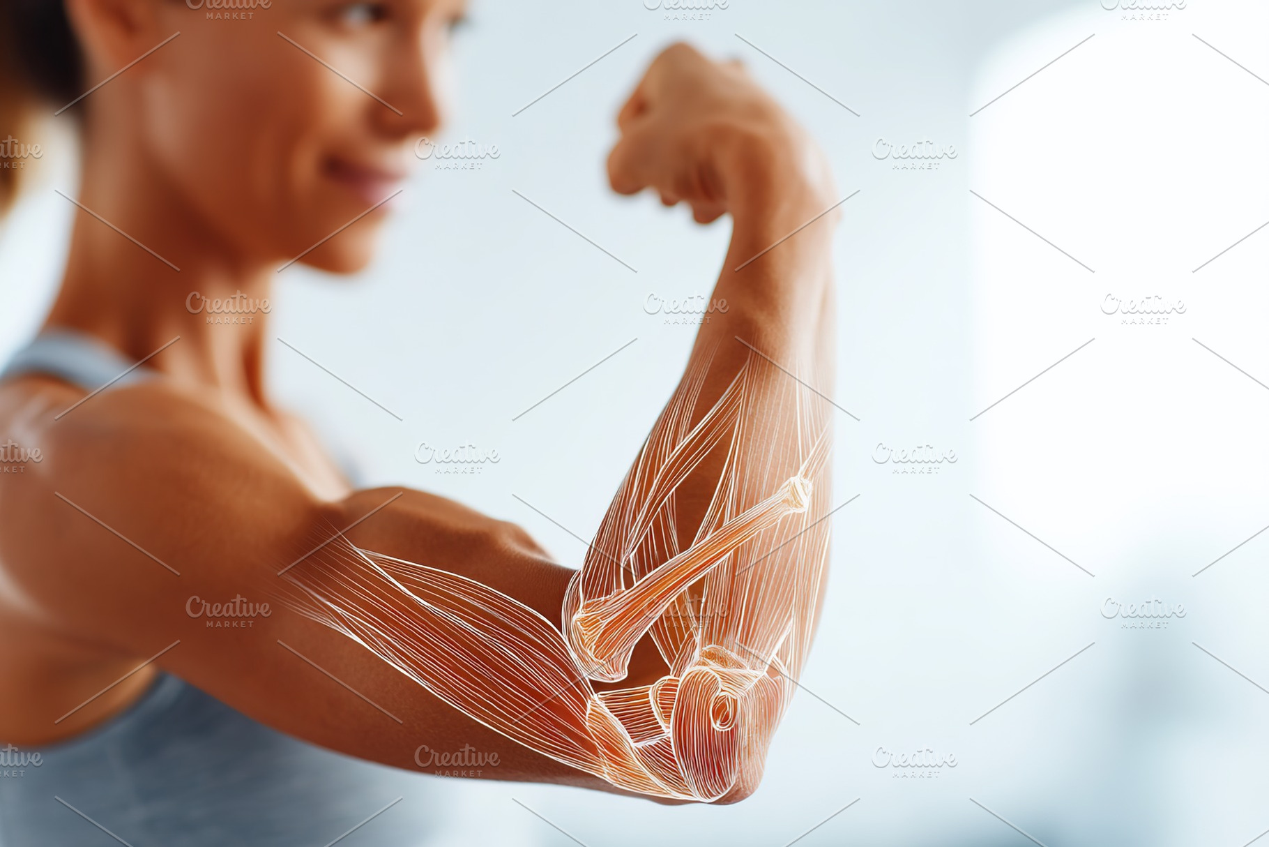 Woman flexes her bicep to showcase muscle anatomy in a bright indoor setting, a Sports & Recreation Photo by AlyaAnd