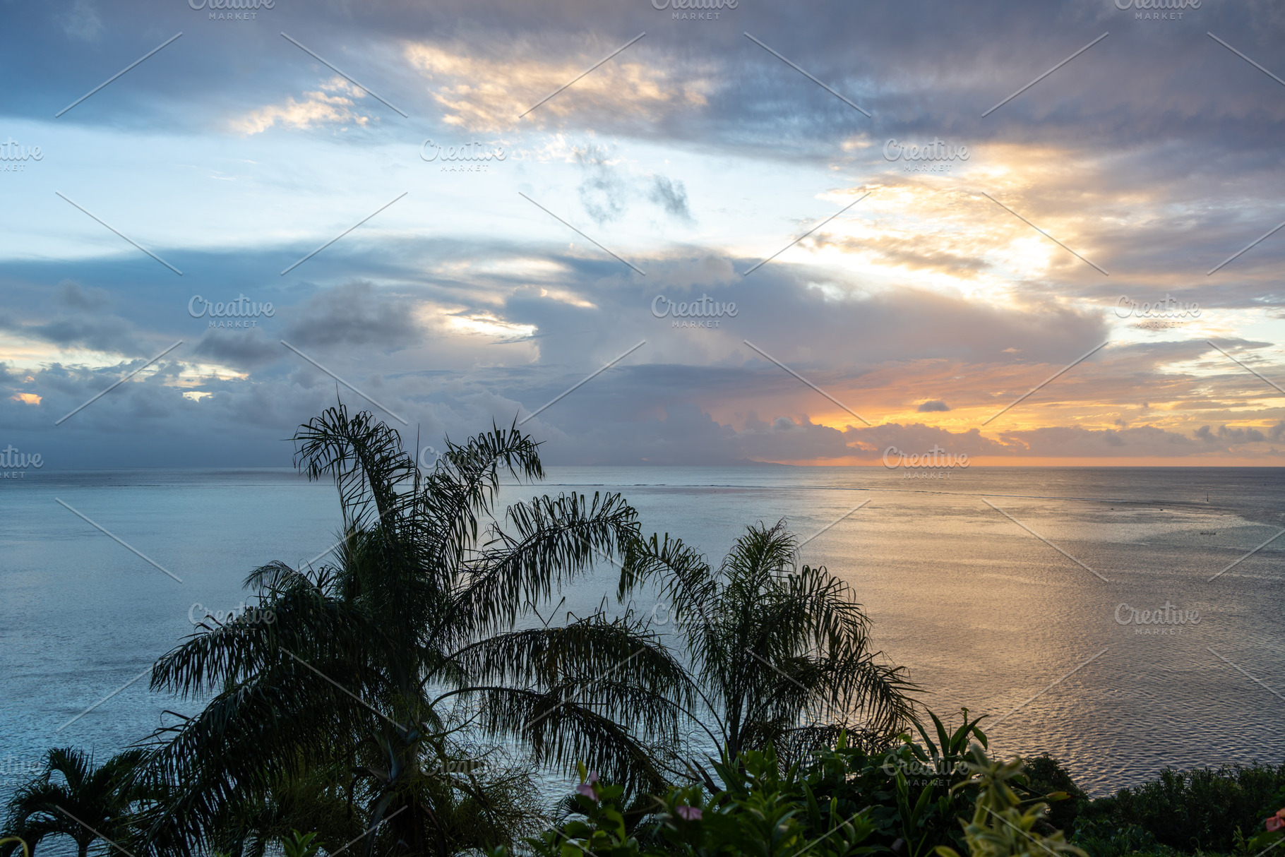 Sunset over the coastline of Huahine, French Polynesia, with lus, a Nature Photo by GoodGoods