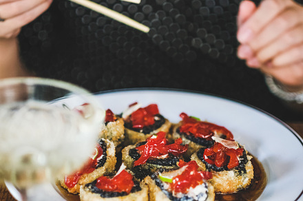 Girl eating baked susi maki with, a Food & Drink Photo by Foxys