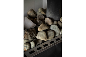 Close-up view of sauna heater with, a Health & Medical Photo by volodymyrshtun13795