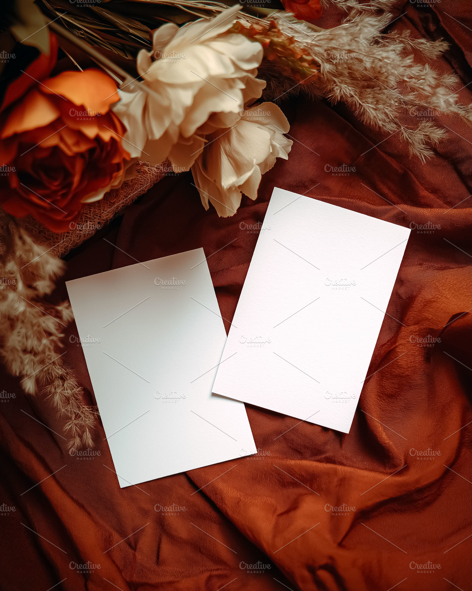 Blank cards mockup on earthy silk fabric with dried flowers, representing rusti, a Holiday Photo by Studio ANNA
