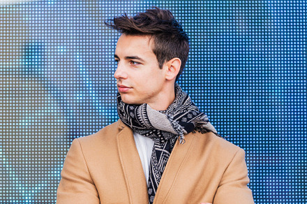 Portrait of stylish handsome young man with coat standing outdoo, a Person Photo by RF Images