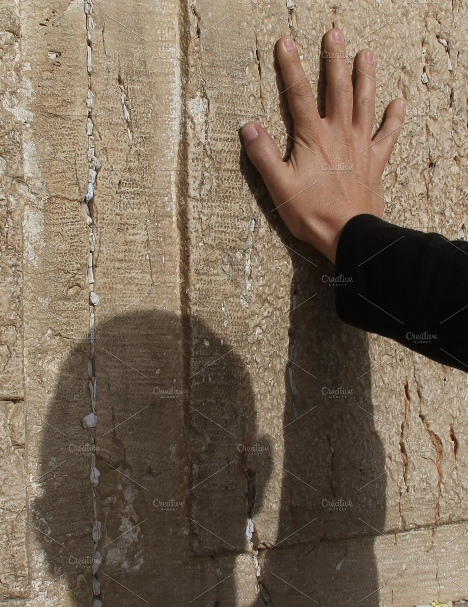 Male hand on a Western wall, a Person Photo by Flik47