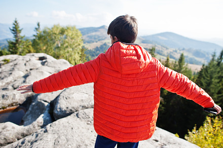 Back of boy on top mountain. Children hiking on beautiful day in, a Nature Photo by AS photostudio
