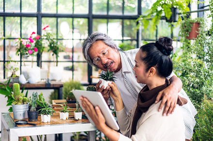 Senior couple asian family having good time using tablet compute
