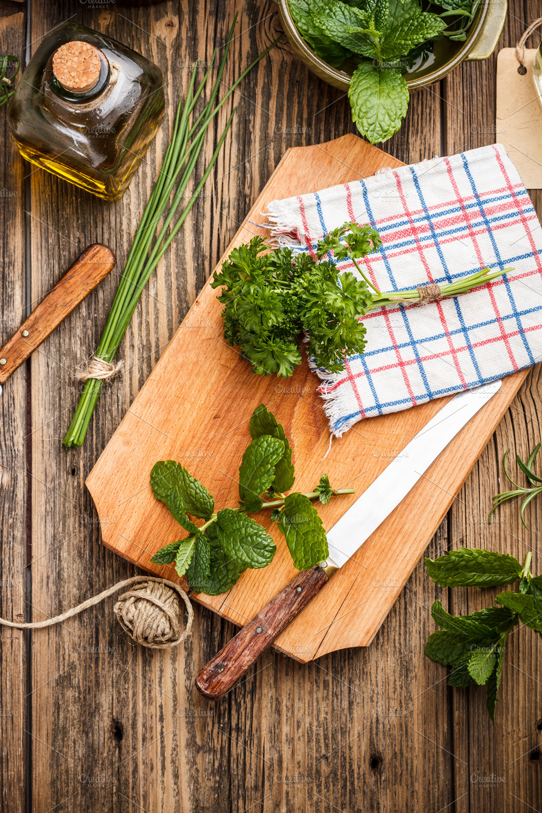 Fresh herbs featuring leaves, still life, and kitchen board