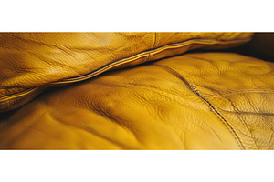 Close-Up of Wrinkled Yellow Leather, a Background Photo by piter.goskov