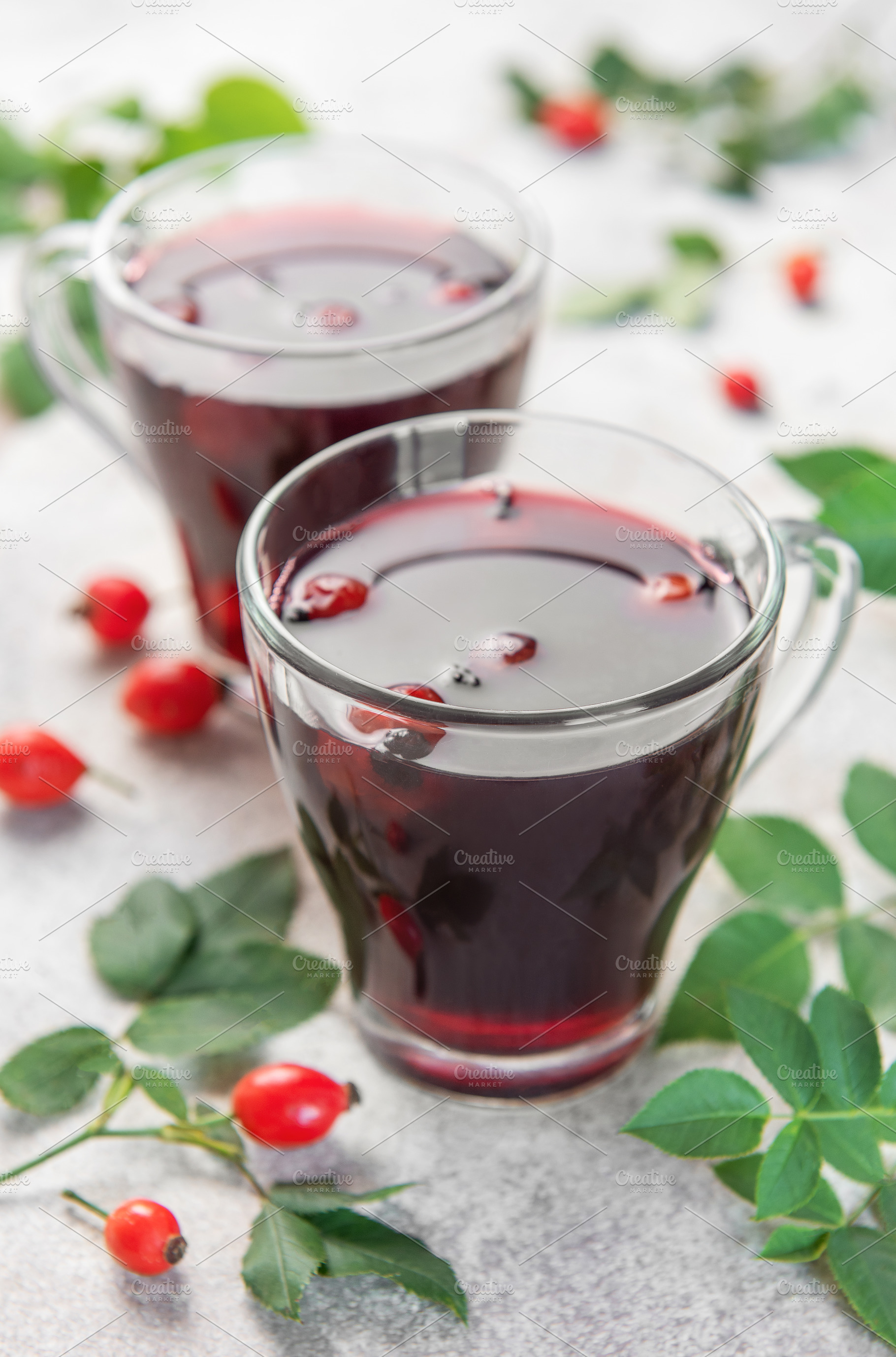 Drinking hot rosehip tea with berries and leaves, a Food & Drink Photo by Olena Rudo