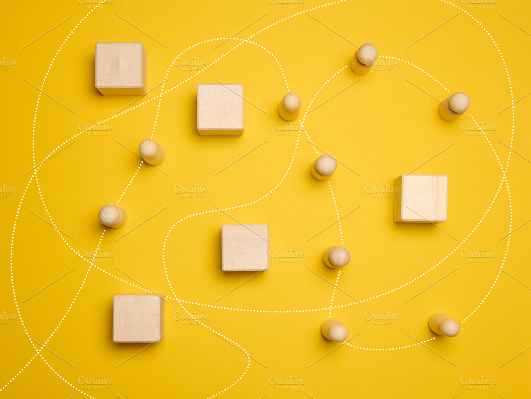 Wooden figures of men and a trajectory between obstacles on a ye, an Abstract Photo by ndanko