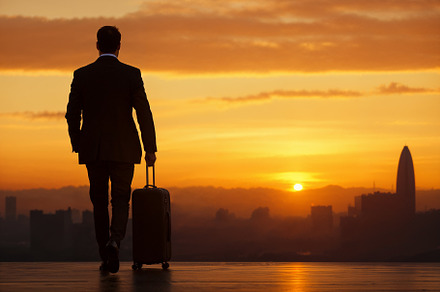Sunset travel moment for a business trip with suitcase., a Holiday Photo by OSORIOartist