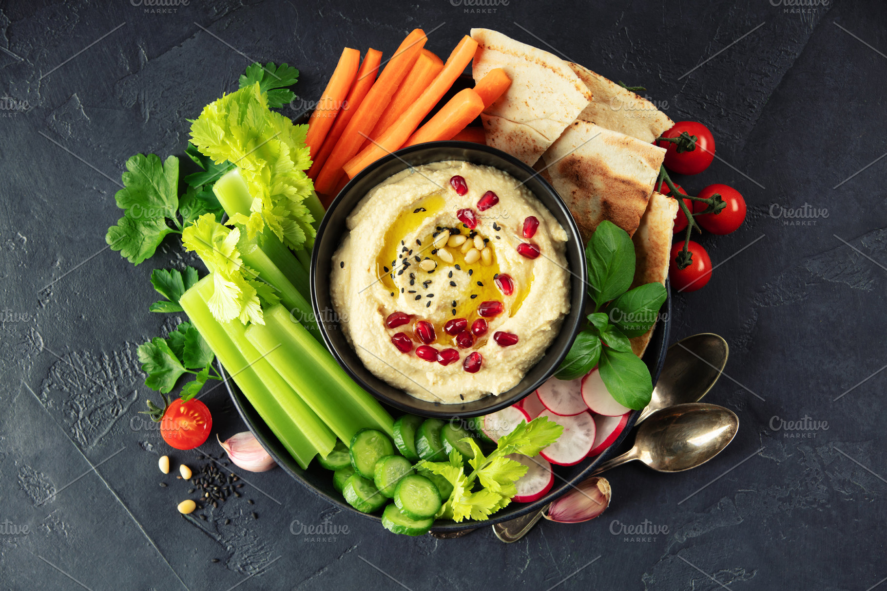 Fresh Hummus Platter with Vegetables and Pita on Dark Background, a Food & Drink Photo by Natalia Klenova's Shop