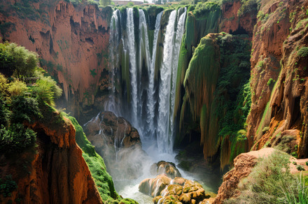 A stunning waterfall plunges from ro, a Photo by Tanuart