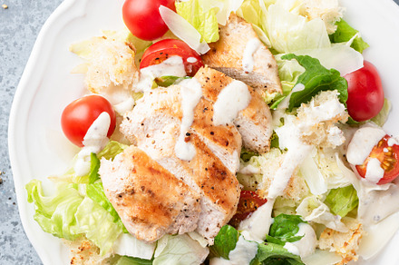 Caesar salad with grilled chicken, a Food & Drink Photo by The baking man