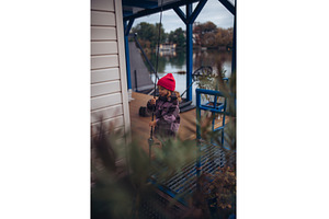 Child enjoying fishing outdoors, a Sports & Recreation Photo by HalfPoint