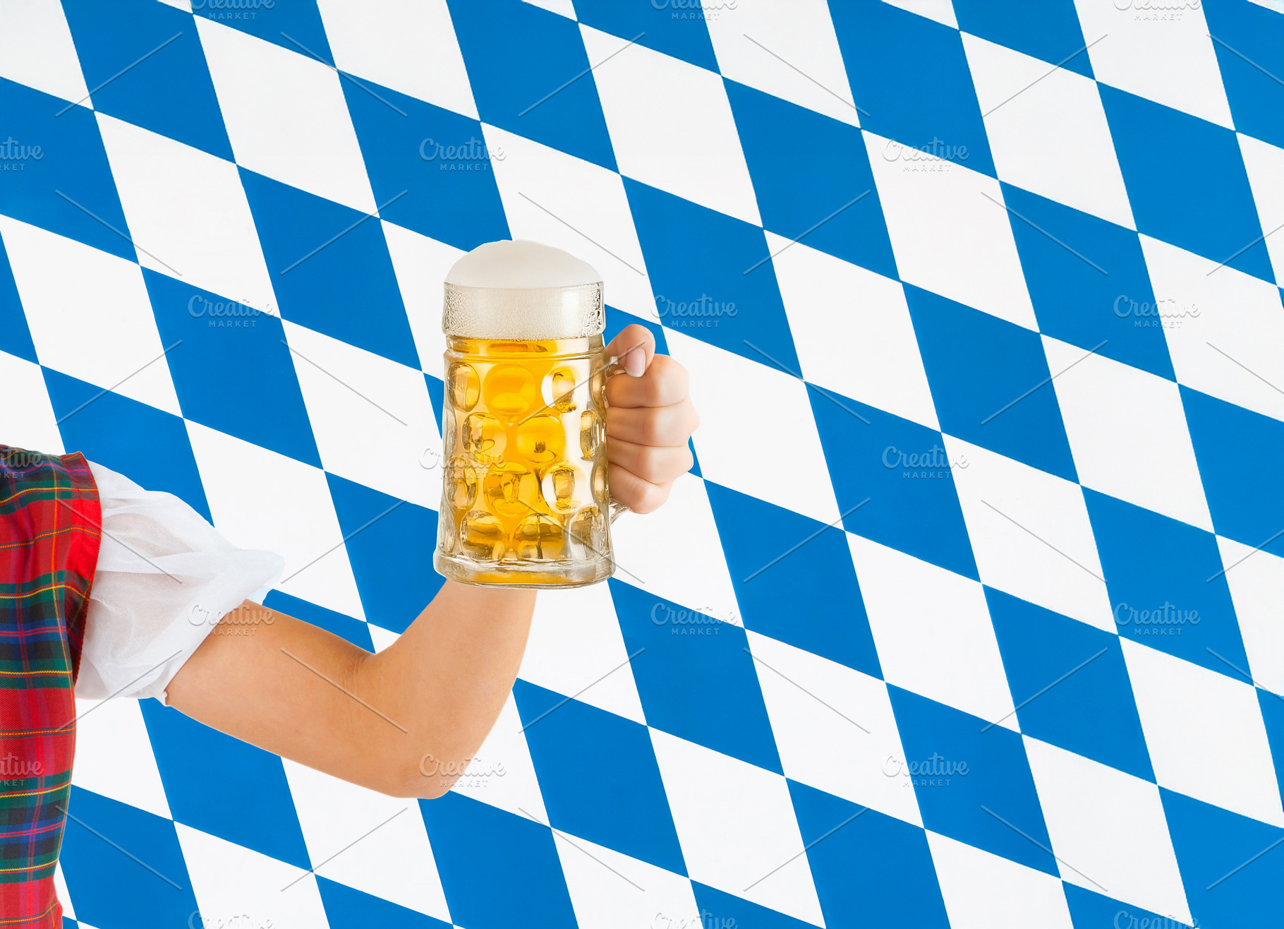 Woman holding beer stein celebrating Oktoberfest in Bavaria, a Food & Drink Photo by Antonio Gravante Market